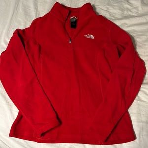 Red north face fleece pull over